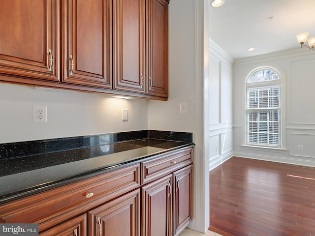 7730 Terraview Ct, Hanover, MD 21076 - kitchen featuring dark stone counters, light wood finished floors, ornamental molding, and recessed lighting