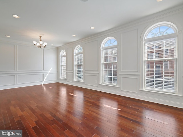 7730 Terraview Ct, Hanover, MD 21076 - unfurnished living room with a decorative wall, a chandelier, wood finished floors, ornamental molding, and recessed lighting