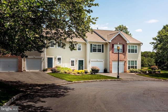 202 Park Knl, Princeton, NJ 08540 - view of front of house featuring driveway, a garage, and brick siding