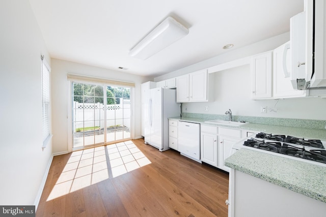 202 Park Knl, Princeton, NJ 08540 - kitchen with white appliances, light wood-type flooring, white cabinetry, and light stone counters