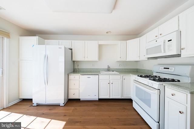 202 Park Knl, Princeton, NJ 08540 - kitchen featuring white appliances, white cabinets, dark wood-type flooring, and light stone counters