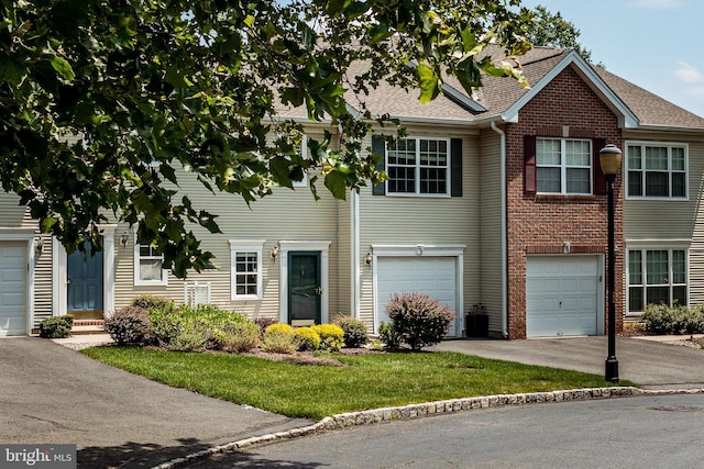 202 Park Knl, Princeton, NJ 08540 - view of property featuring driveway, a garage, brick siding, a front lawn, and a shingled roof