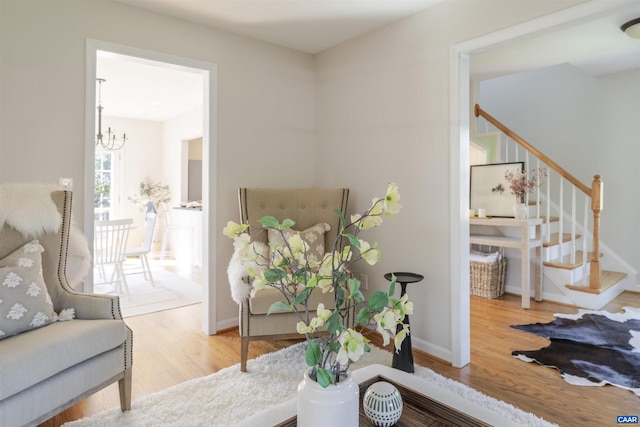 324 NW 8th St, Charlottesville, VA 22903 - living area featuring a chandelier, stairs, and wood finished floors