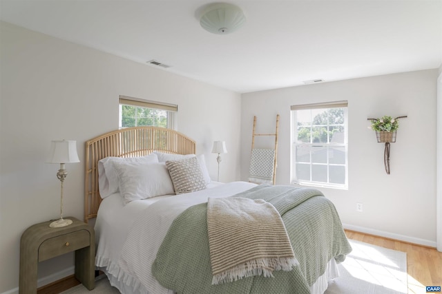 324 NW 8th St, Charlottesville, VA 22903 - bedroom with light wood-type flooring and baseboards