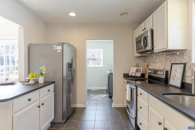324 NW 8th St, Charlottesville, VA 22903 - kitchen featuring stainless steel appliances, plenty of natural light, dark countertops, backsplash, and recessed lighting
