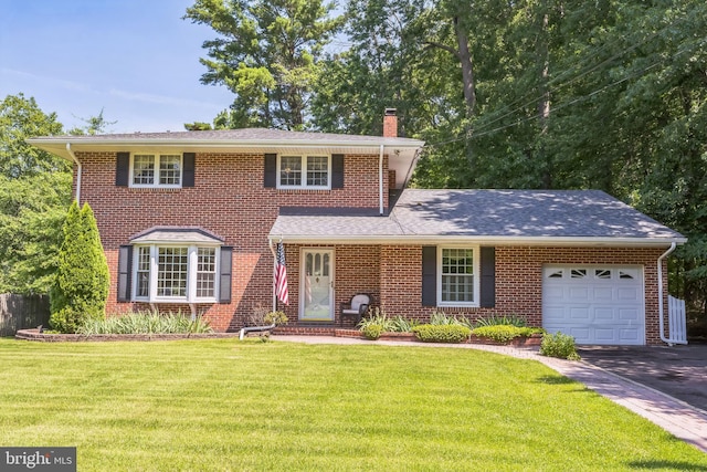 604 Big Oak Rd, Yardley, PA 19067 - view of front of property featuring a chimney, an attached garage, a front lawn, and brick siding