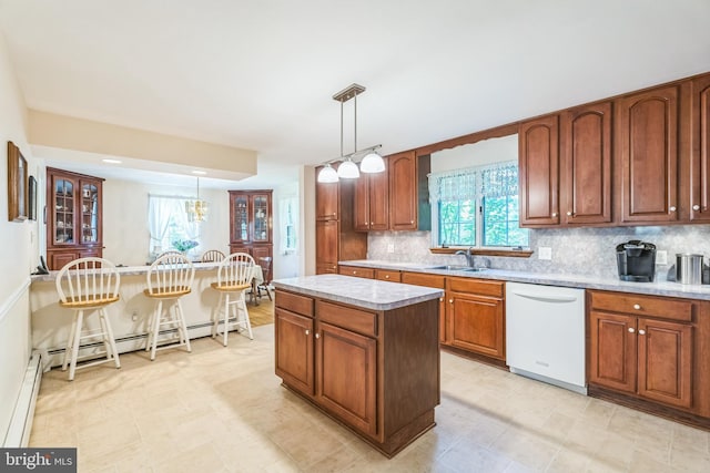 604 Big Oak Rd, Yardley, PA 19067 - kitchen with white dishwasher, backsplash, light countertops, and pendant lighting