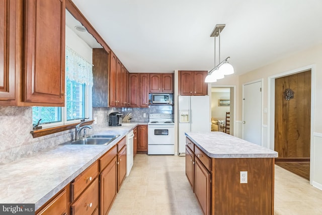 604 Big Oak Rd, Yardley, PA 19067 - kitchen with white appliances, backsplash, a kitchen island, light countertops, and pendant lighting