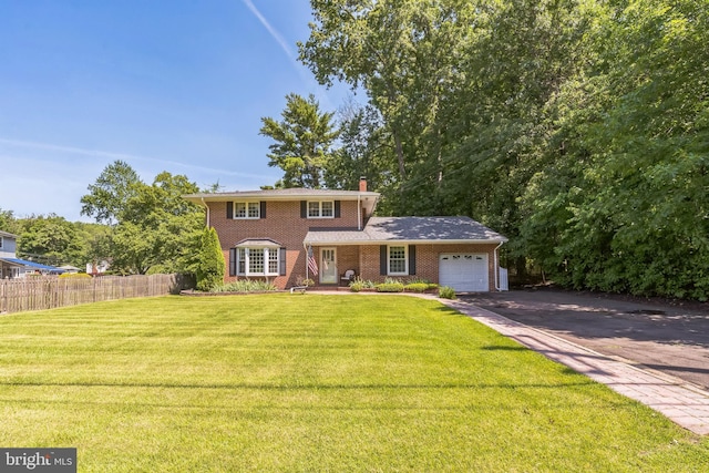 604 Big Oak Rd, Yardley, PA 19067 - view of front of property with an attached garage, brick siding, driveway, and a chimney