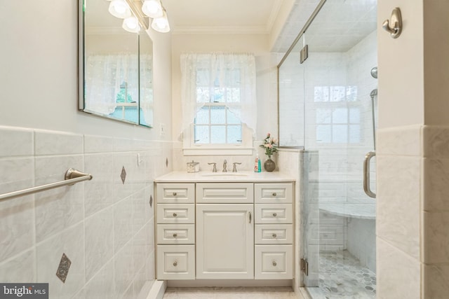 604 Big Oak Rd, Yardley, PA 19067 - bathroom featuring crown molding, tile walls, a shower stall, vanity, and a wainscoted wall