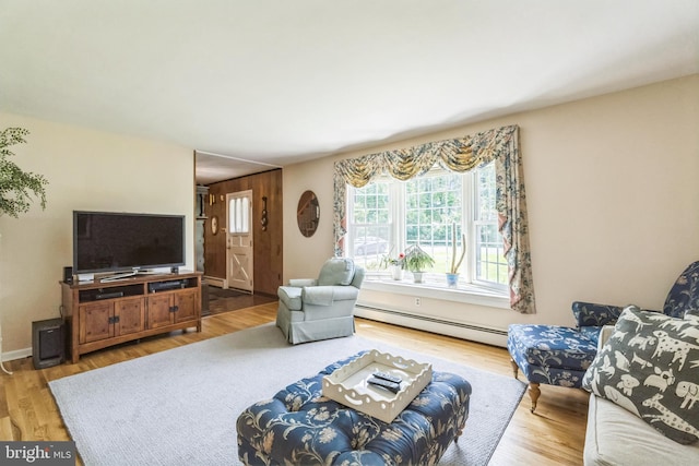 604 Big Oak Rd, Yardley, PA 19067 - living area with a baseboard heating unit and wood finished floors