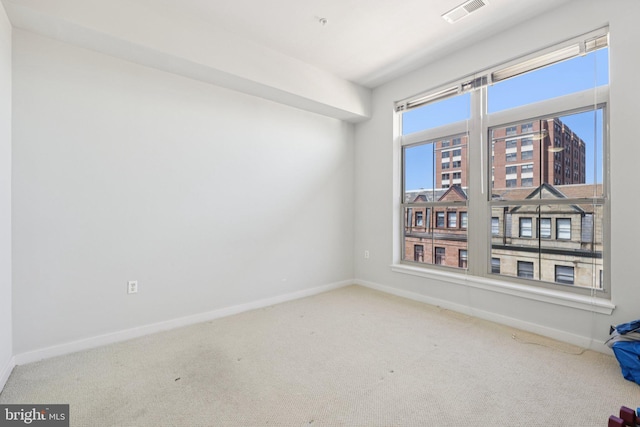 1209 N Charles St Unit 409, Baltimore, MD 21201 - carpeted empty room with baseboards