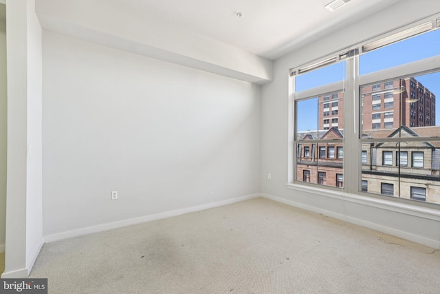 1209 N Charles St Unit 409, Baltimore, MD 21201 - carpeted spare room with baseboards