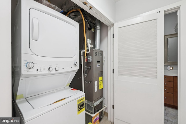 1209 N Charles St Unit 409, Baltimore, MD 21201 - laundry area with stacked washing machine and dryer