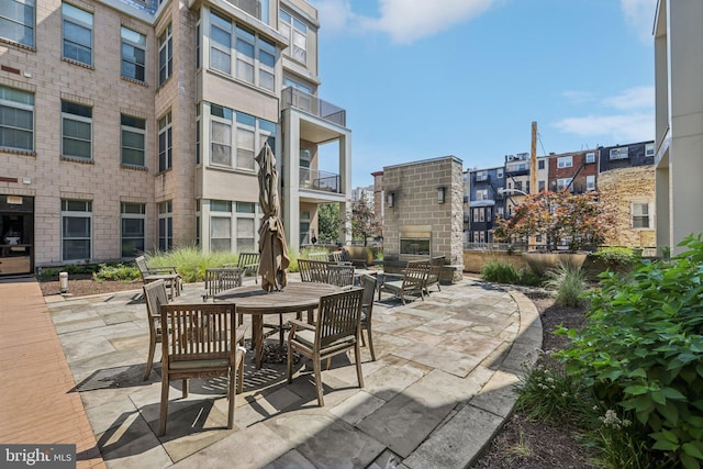 1209 N Charles St Unit 409, Baltimore, MD 21201 - view of patio / terrace featuring a fireplace