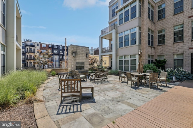 1209 N Charles St Unit 409, Baltimore, MD 21201 - view of patio / terrace featuring an outdoor living space with a fireplace