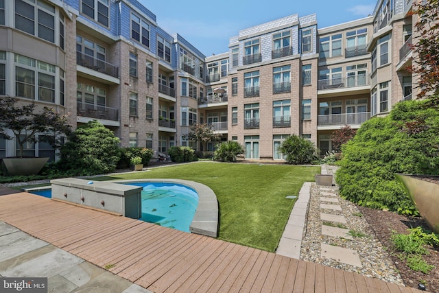 1209 N Charles St Unit 409, Baltimore, MD 21201 - view of swimming pool featuring a yard