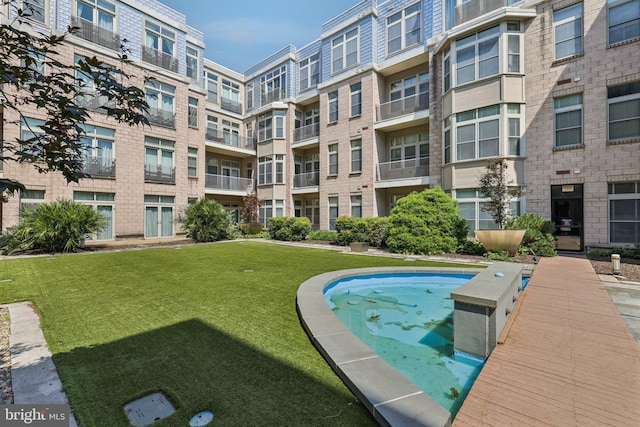 1209 N Charles St Unit 409, Baltimore, MD 21201 - view of swimming pool featuring a yard