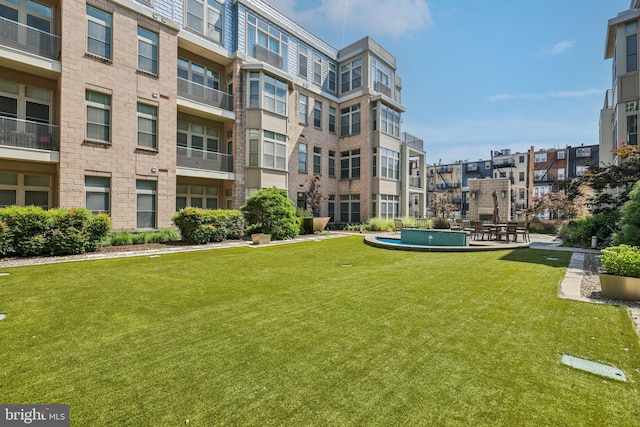1209 N Charles St Unit 409, Baltimore, MD 21201 - view of property's community with a lawn