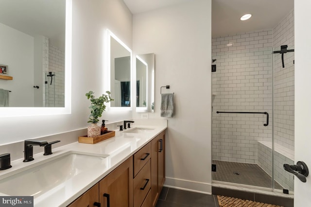 11237 Beaker St, Reston, VA 20190 - bathroom with a shower stall, double vanity, tile patterned floors, and recessed lighting