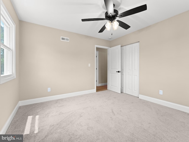 713 Franklinville Rd, Mullica Hill, NJ 08062 - unfurnished bedroom with carpet, a closet, and a ceiling fan