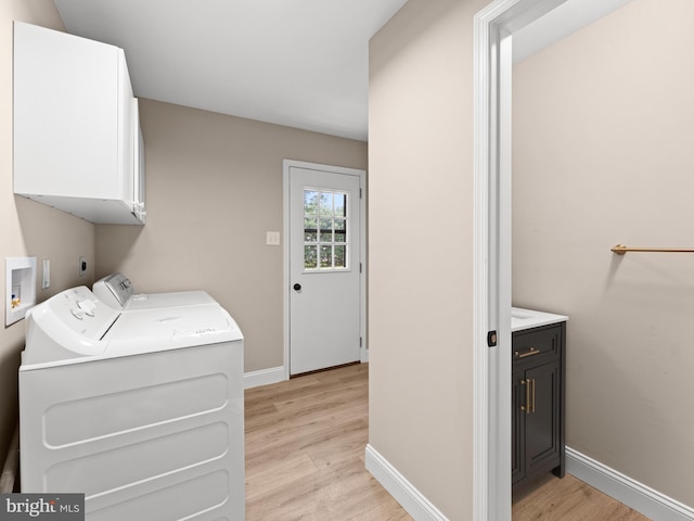 713 Franklinville Rd, Mullica Hill, NJ 08062 - laundry area with cabinet space, light wood-type flooring, and separate washer and dryer
