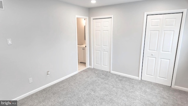 54 Liborio Ln, New Castle, DE 19720 - unfurnished bedroom featuring carpet floors, multiple closets, connected bathroom, and recessed lighting