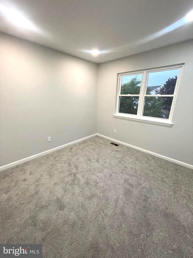 54 Liborio Ln, New Castle, DE 19720 - carpeted empty room featuring baseboards