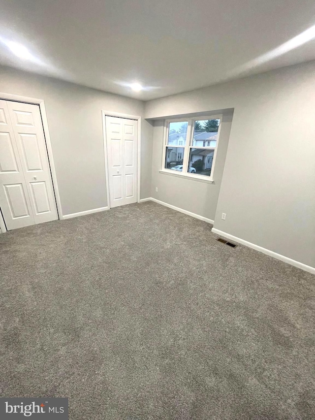 54 Liborio Ln, New Castle, DE 19720 - unfurnished bedroom with carpet floors and two closets