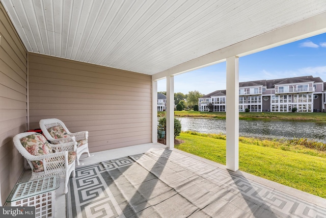 37166 Gull Watch Way Unit 1315, Selbyville, DE 19975 - unfurnished sunroom featuring a water view and a residential view