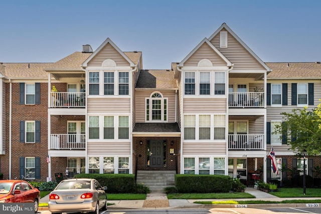 12259 Ladymeade Ct Unit 201, Woodbridge, VA 22192 - view of building exterior with uncovered parking