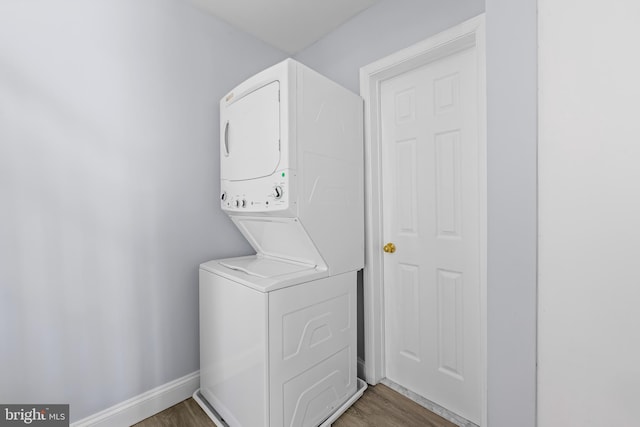 239 W Lafayette Ave, Baltimore, MD 21217 - washroom with estacked washer and dryer and wood finished floors