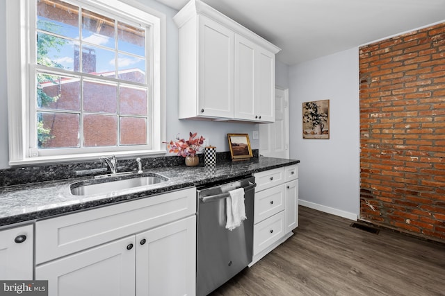 239 W Lafayette Ave, Baltimore, MD 21217 - kitchen featuring stainless steel dishwasher, brick wall, white cabinetry, dark wood-type flooring, and dark stone counters