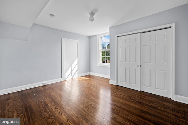239 W Lafayette Ave, Baltimore, MD 21217 - unfurnished bedroom featuring dark wood-style floors and a closet