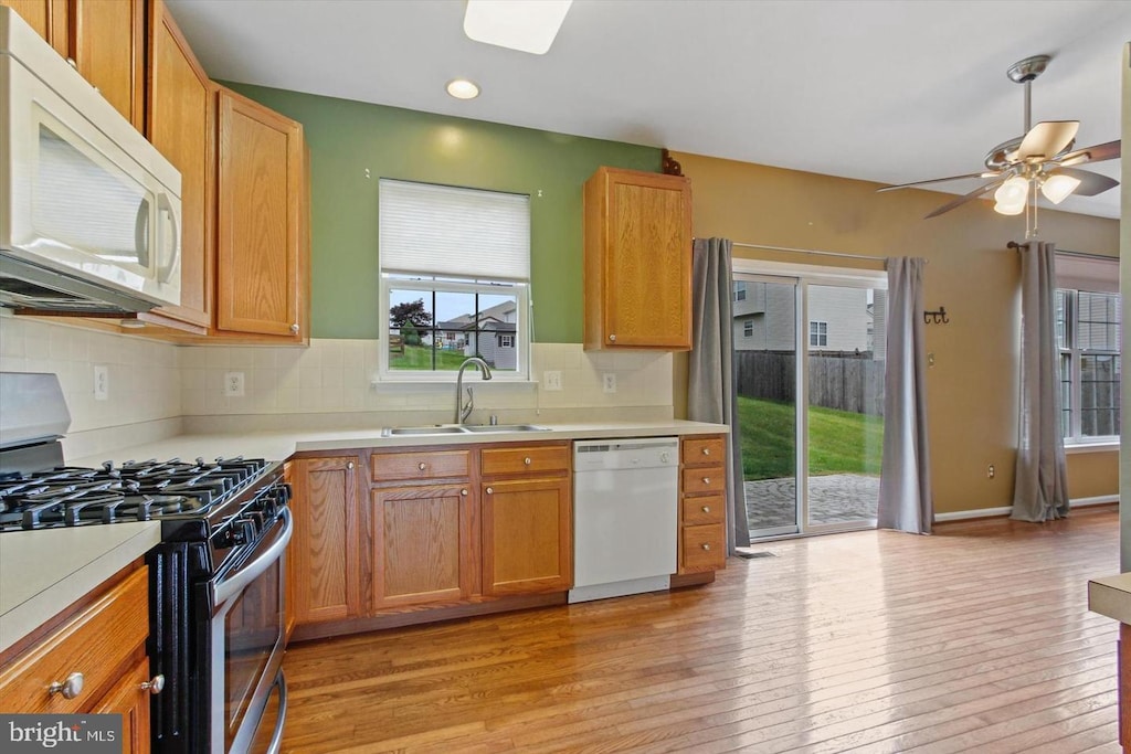 38 Menlena Cir, Hanover, PA 17331 - kitchen featuring white appliances, ceiling fan, light wood finished floors, light countertops, and tasteful backsplash