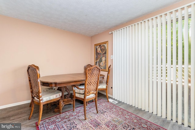 845 Angel Valley Ct, Edgewood, MD 21040 - dining area featuring wood finished floors and a textured ceiling