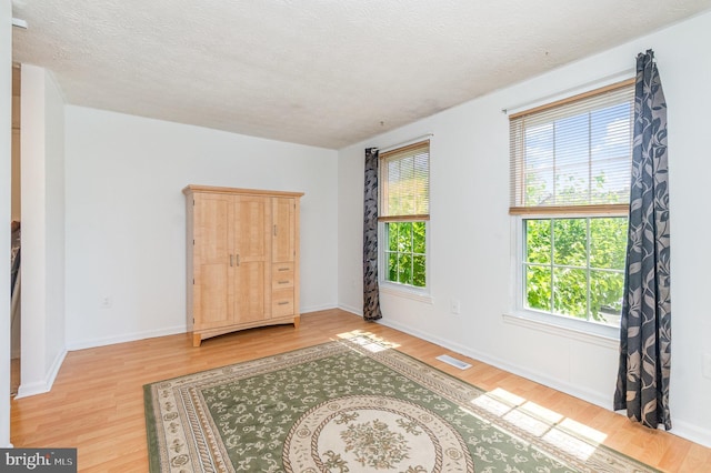 845 Angel Valley Ct, Edgewood, MD 21040 - spare room with light wood-style flooring and a textured ceiling
