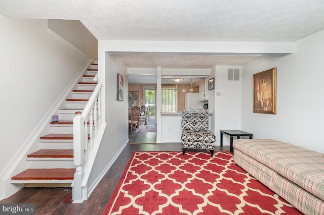 845 Angel Valley Ct, Edgewood, MD 21040 - living room featuring stairs, wood finished floors, and a textured ceiling