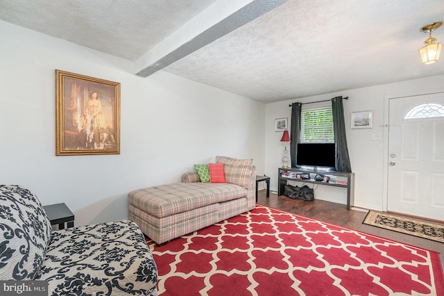 845 Angel Valley Ct, Edgewood, MD 21040 - living area featuring wood finished floors, plenty of natural light, a textured ceiling, and beam ceiling