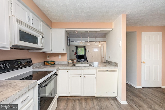 845 Angel Valley Ct, Edgewood, MD 21040 - kitchen featuring white appliances, wood finished floors, white cabinetry, and a textured ceiling