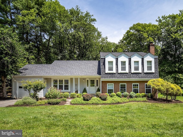 14901 Joshua Tree Rd, North Potomac, MD 20878 - view of front facade with an attached garage, a front yard, a chimney, and roof with shingles