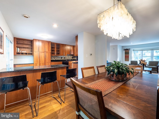 14901 Joshua Tree Rd, North Potomac, MD 20878 - dining area with light wood-style flooring and a chandelier