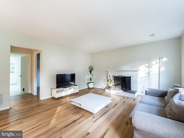 14901 Joshua Tree Rd, North Potomac, MD 20878 - living room featuring wood finished floors and a fireplace