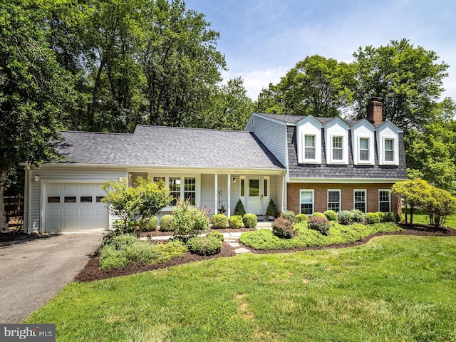 14901 Joshua Tree Rd, North Potomac, MD 20878 - tri-level home featuring a front yard, driveway, an attached garage, a chimney, and a shingled roof