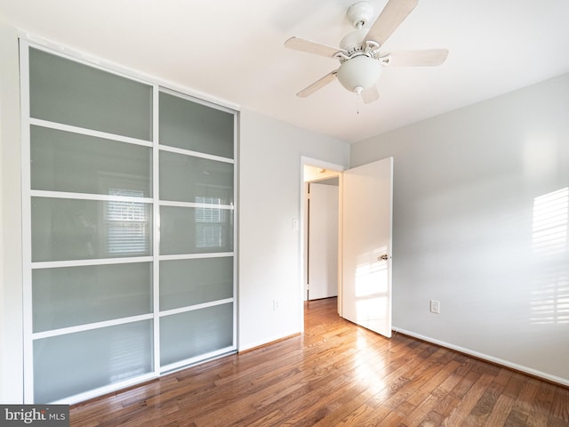 14901 Joshua Tree Rd, North Potomac, MD 20878 - unfurnished bedroom with wood finished floors and ceiling fan