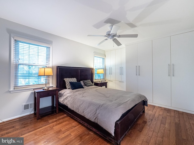 14901 Joshua Tree Rd, North Potomac, MD 20878 - bedroom with wood finished floors, multiple windows, and a ceiling fan