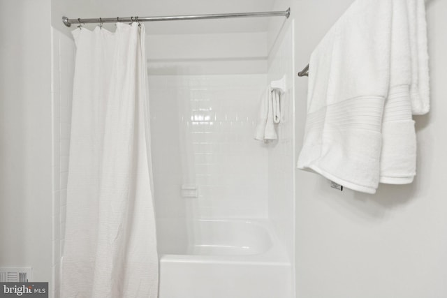 10164 Sassafras Woods Ct, Burke, VA 22015 - bathroom featuring shower / bath combo with shower curtain