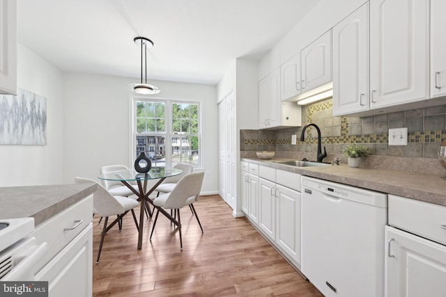 10164 Sassafras Woods Ct, Burke, VA 22015 - kitchen featuring dishwasher, light wood-style flooring, decorative backsplash, white cabinetry, and hanging light fixtures