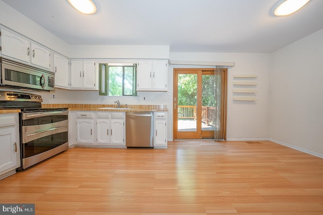 1368 Abbey Way, Bensalem, PA 19020 - kitchen with appliances with stainless steel finishes, light wood-type flooring, white cabinetry, and light countertops