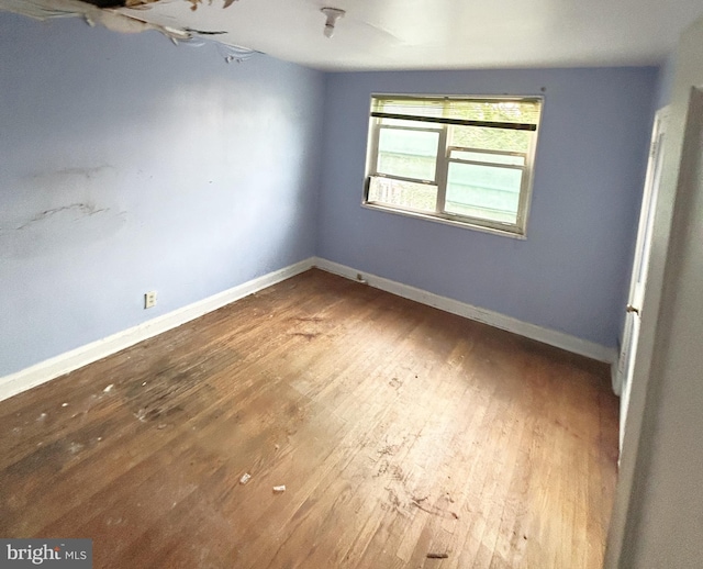 4706 Alhambra Ave, Baltimore, MD 21212 - empty room with wood finished floors and baseboards